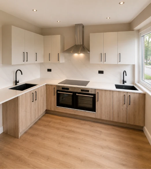 Modern fitted kitchen installation with bespoke cabinetry, quartz worktops, integrated appliances and custom carpentry by Botnari Construction.